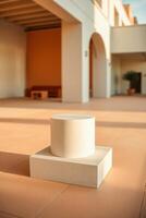 white cylindrical display on square base modern setting photo