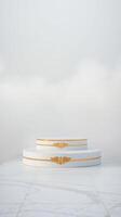 two-tiered circular display platforms with gold detailing photo