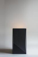 dark angular block on gray surface photo
