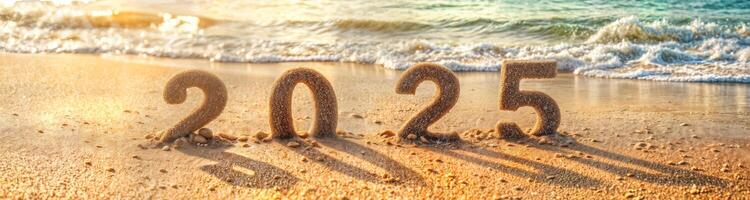 sand numerals 2025 on a sunset beach photo