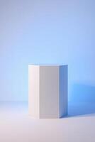 white hexagonal block stands on a white surface against a light blue background. photo