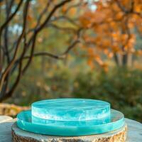 two teal resin platforms on a tree slice photo