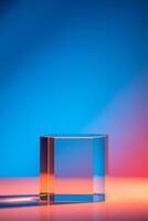 transparent hexagonal glass block rests on a reflective surface lit by dynamic blue red lighting. photo