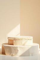 two-tiered round platforms with a stone-like texture illuminated by soft sunlight photo