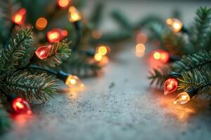 illuminated string lights resting on artificial evergreen branches photo