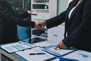 Business handshake for teamwork of business merger and acquisition,successful negotiate,hand shake,two businessman shake hand with partner to celebration partnership and business deal concept photo