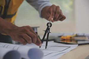 Image of engineer meeting for architectural project. working with partner and engineering tools on workplace vintage tone. photo