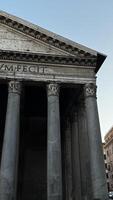 Historical architecture of the Pantheon in Rome at twilight showcasing iconic columns and classical design elements photo