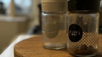 Beautifully arranged Elegant Spice Jars placed on a Wooden Surface, adding charm and style photo