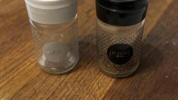Various Containers of Seasoning Arranged on a Wooden Surface for Cooking and Presentation photo