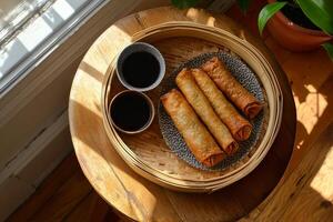 Delicious Crispy Spring Rolls with Soy Sauce, a Perfect Asian-Inspired Meal photo
