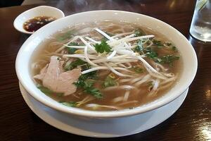 Delicious Vietnamese Pho Soup with Chicken and Bean Sprouts photo