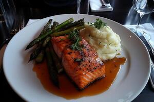 Delicious Grilled Salmon with Mashed Potatoes and Asparagus photo