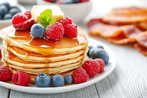 Delicious Stack of Pancakes with Berries and Syrup photo