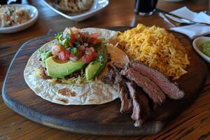 Delicious Mexican Taco with Rice, Steak, and Avocado photo