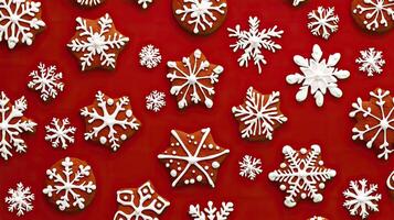 Christmas gingerbread cookies in the form of snowflake on a red background. photo