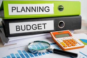 Planning budget. Binder data finance report business with graph analysis in office. photo