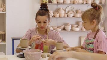 Kids enjoy pottery making together in a creative workshop setting video