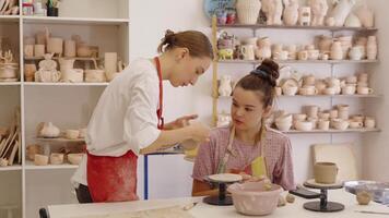 Pottery class in a cozy studio with instruction and creation process video