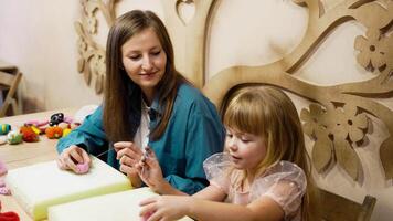 Crafting fun with kids at a hands-on workshop in a cozy art studio video