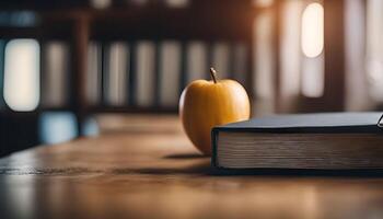 Apple and Book on Wooden Table photo