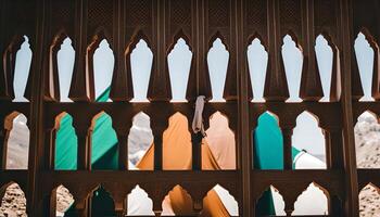 Intricate Latticework Window with a Glimpse of Mountains and Sky photo