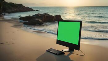 Computer on the Beach at Sunset photo