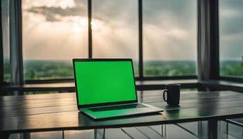 Laptop and Coffee Cup on a Table with Window View photo