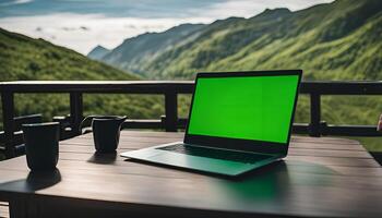 Laptop on a Balcony with a Mountain View photo