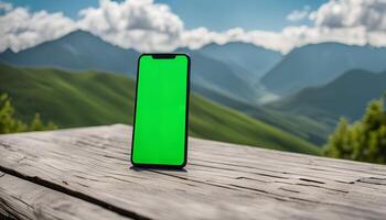 Smartphone on a Wooden Table with Mountain View photo