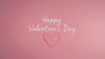A soft pink background features a warm message wishing a Happy Valentine's Day, accompanied by a delicate heart drawing, perfect for expressing love and affection on this special occasion. photo