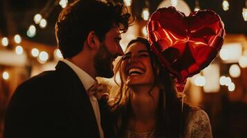 A couple shares a tender moment under warm string lights, with laughter and joy evident on their faces. The woman holds a heart-shaped balloon, adding to the romantic atmosphere of the evening. photo