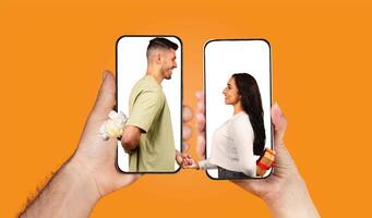 A couple shares a sweet moment through their smartphones, exchanging messages and gestures of love. Their hands are visible, holding the devices with affection. photo