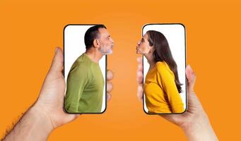 A couple holds smartphones displaying their faces, emphasizing their affection. The bright background enhances the warmth of their connection through text and messaging. photo