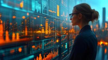 A data analyst observes glowing financial charts displayed on a large screen. The city skyline is visible in the background, illuminated by sunset hues, creating a vibrant atmosphere. photo