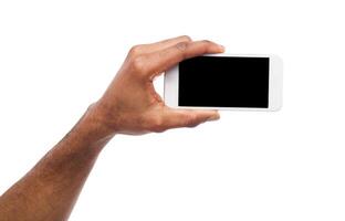 Man taking picture using smartphone. Black hand holding smartphone and shooting photo, isolated on white photo