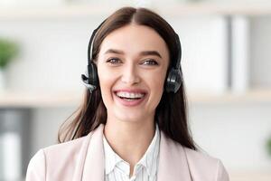 Portrait Of Hotline Operator Woman Wearing Headset Talking And Smiling Looking At Camera Consulting Customer In Office. Online Consultation With Professional Consultant Or Manager Via Call photo