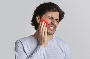 Dental care and health concept. Despaired man endure pain, empty space photo