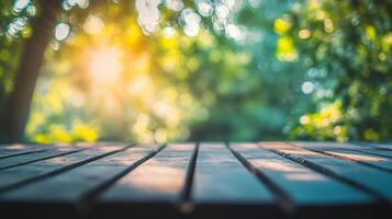 A wooden table with a view of trees and a sun shining on it photo