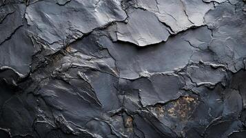 A black and grey rock with a rough texture photo