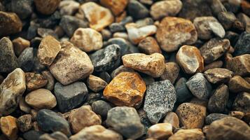 A pile of rocks with some of them being brown and some of them being gray photo