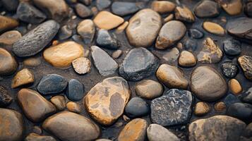 A close up of a rocky surface with a few large rocks and some smaller ones photo