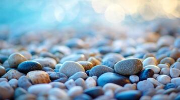A beach scene with a large number of rocks scattered across the sand photo