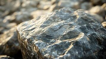 A large rock with a rough surface and a few small cracks photo
