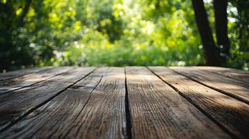 A wooden table with a view of trees and a bright sunny day photo