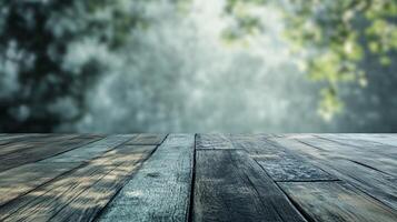A wooden table with a view of trees in the background photo