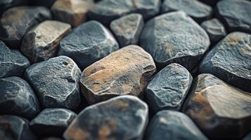 A close up of a pile of rocks with a few of them being slightly lighter in color photo