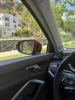 Scenic drive with view of green park and modern buildings on sunny day photo