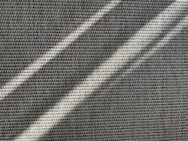 Textured fabric with light reflections creating patterns in the afternoon photo