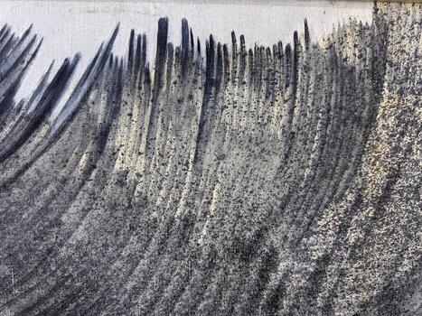 Abstract patterns of texture and form in black and gray hues on a surface photo